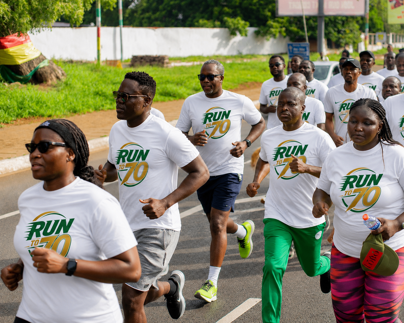 PERSCOBA alumni runners wearing white RUN to 70 shirts at a health walk